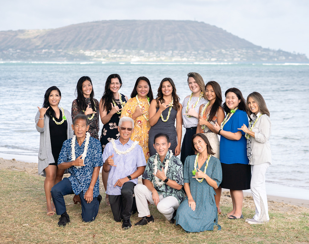 The CareSift team, in lei, on the beach
